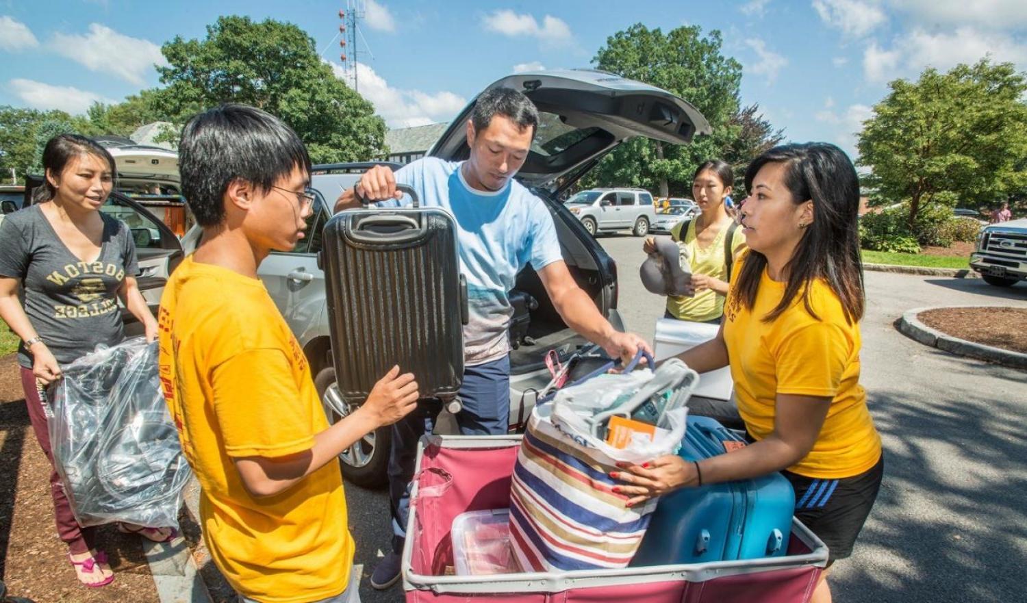 parents helping their daughter unpack